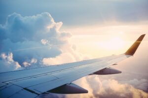 Cargo aircraft wing above the clouds